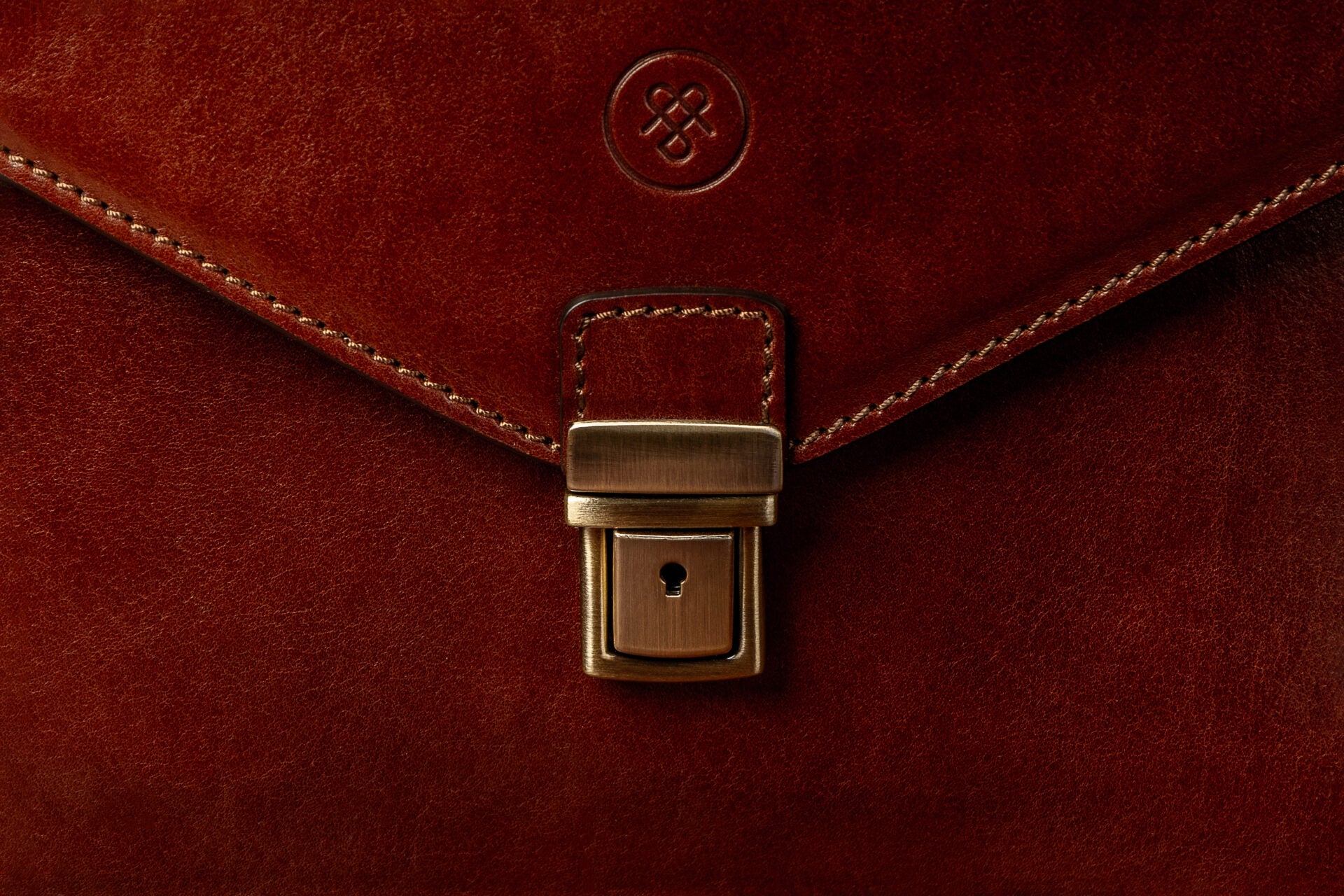 Close-up of Lorenzo leather briefcase showing fine Italian leather grain
